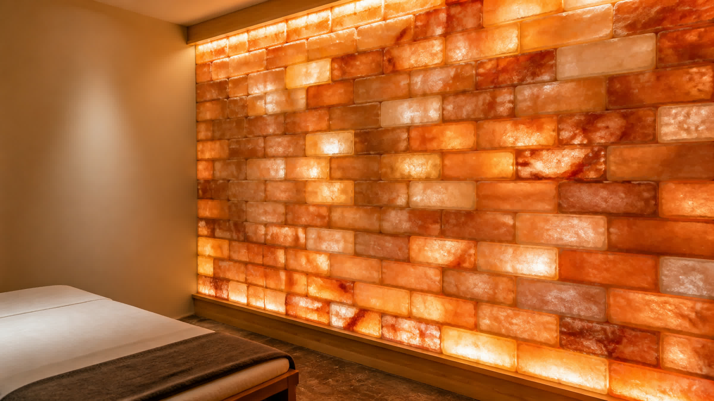 Backlit Himalayan salt brick wall in a treatment room